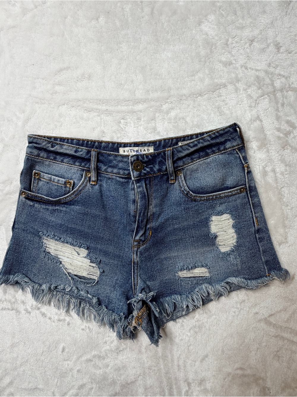 BullHead denim Co. Women's Distressed Blue Denim cutoff mid/high rise Shorts.